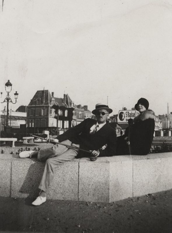 James Joyce with Nora, seated on wall